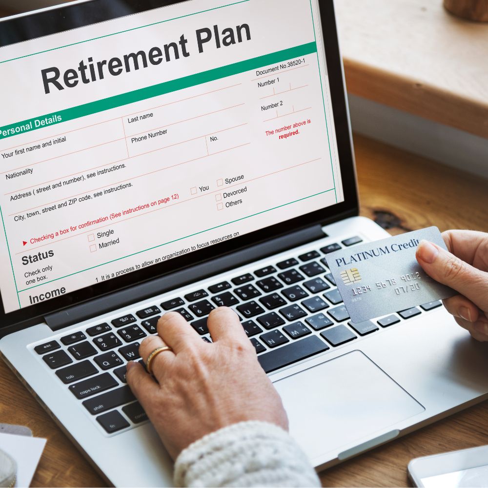 person on laptop looking at pension software interface