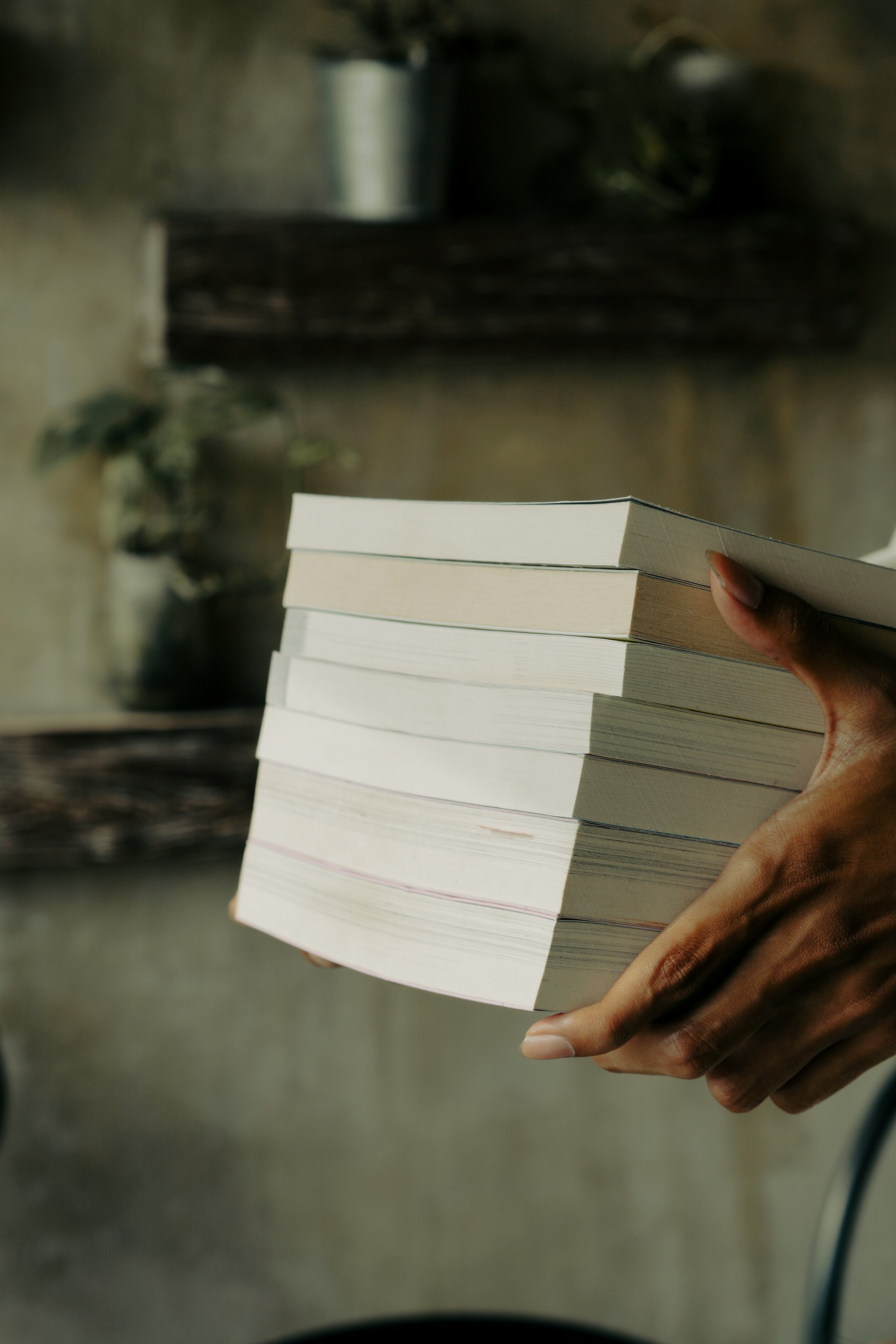 A Stack of Books in a hand