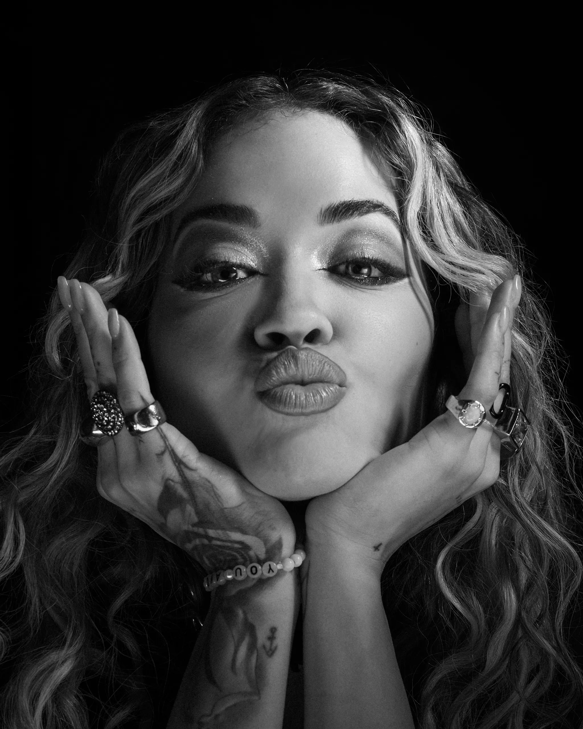 Portrait of Rita Ora with high contrast kiss mouth