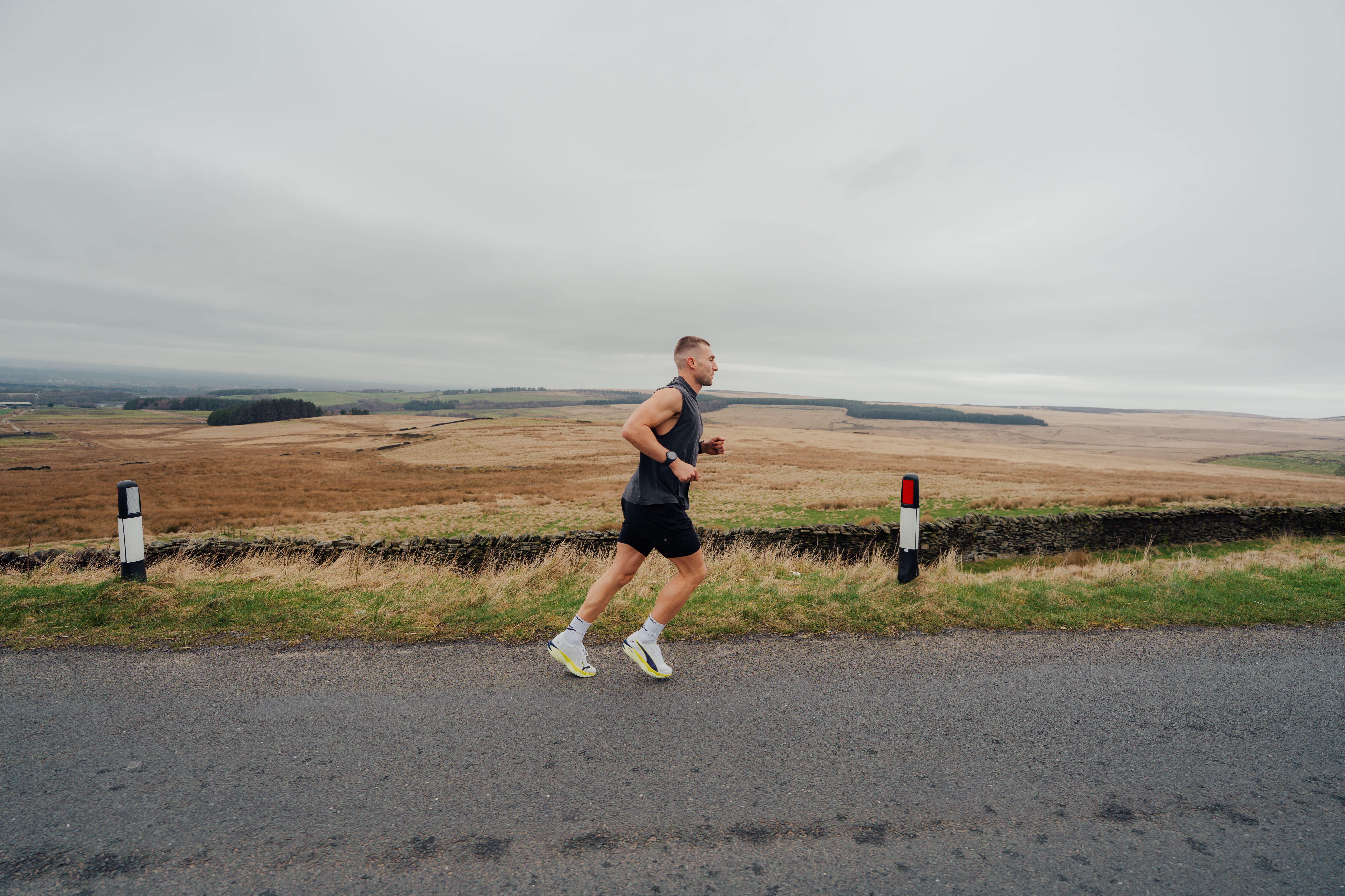 man on mountain range - Strength Training Workout for Runners