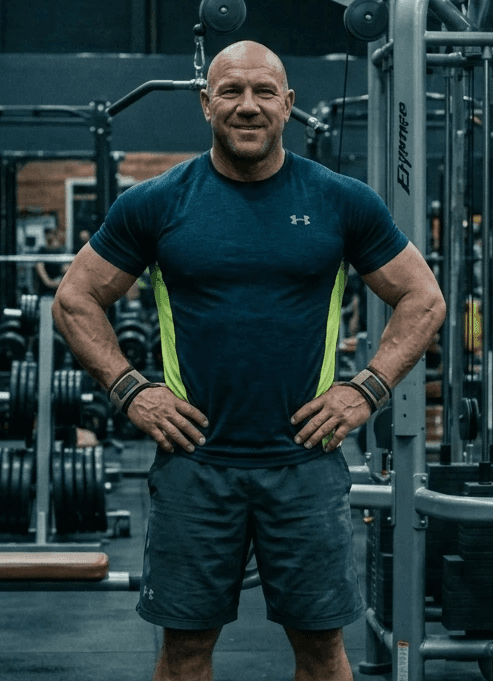 man wearing green crew-neck t-shirt looking upwards
