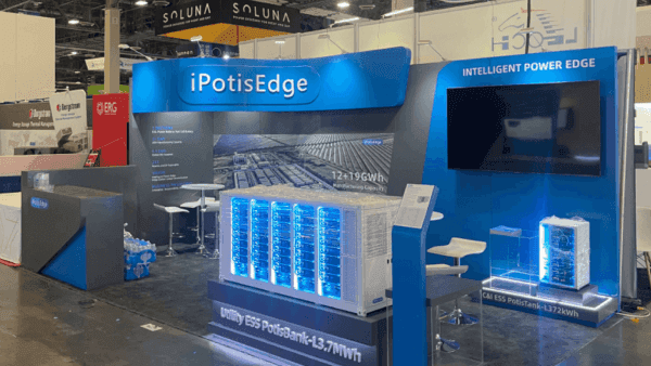 20x20 RE+ Southeast booth overview with energy storage product samples, meeting counter, and technical presentation layout