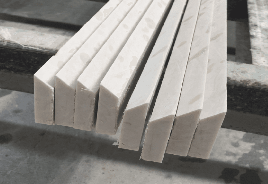 Freshly cut stone slabs with smooth, chamfered edges produced by the Dinosaw Manual Edge Cutting Machine, illustrating its excellent finishing quality.