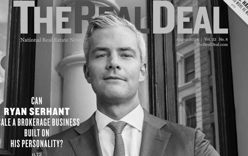 A person stands in a dark space with glowing, circular light patterns in orange and blue hues, creating a surreal and futuristic vibe.