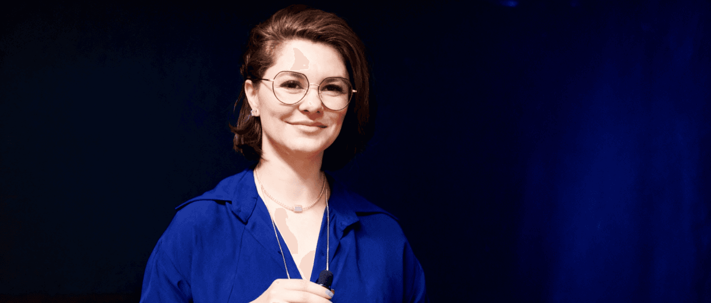 woman standing next to pink wall while scratching her head