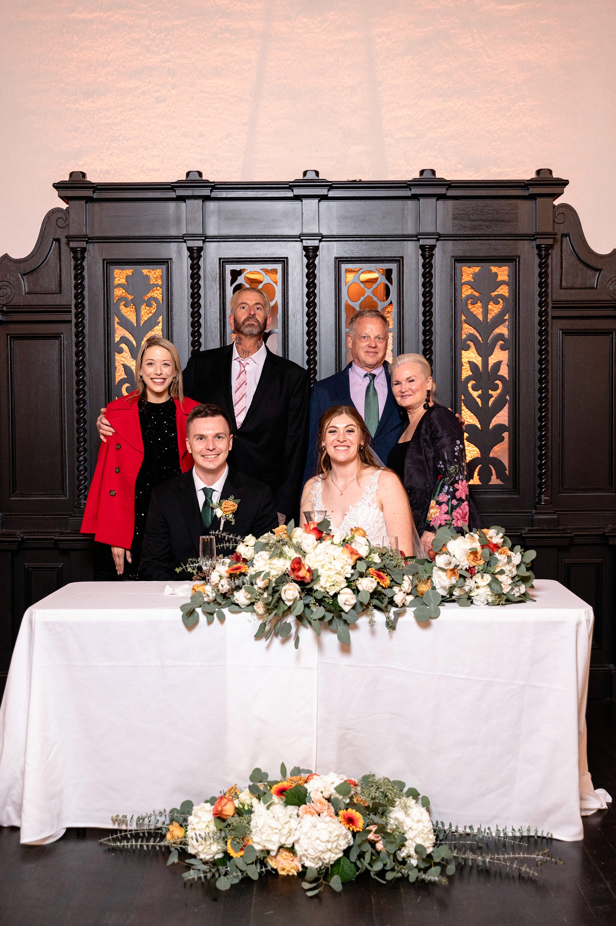 Flat lay wedding details with bouquet, rings, and sparkling bridal heels