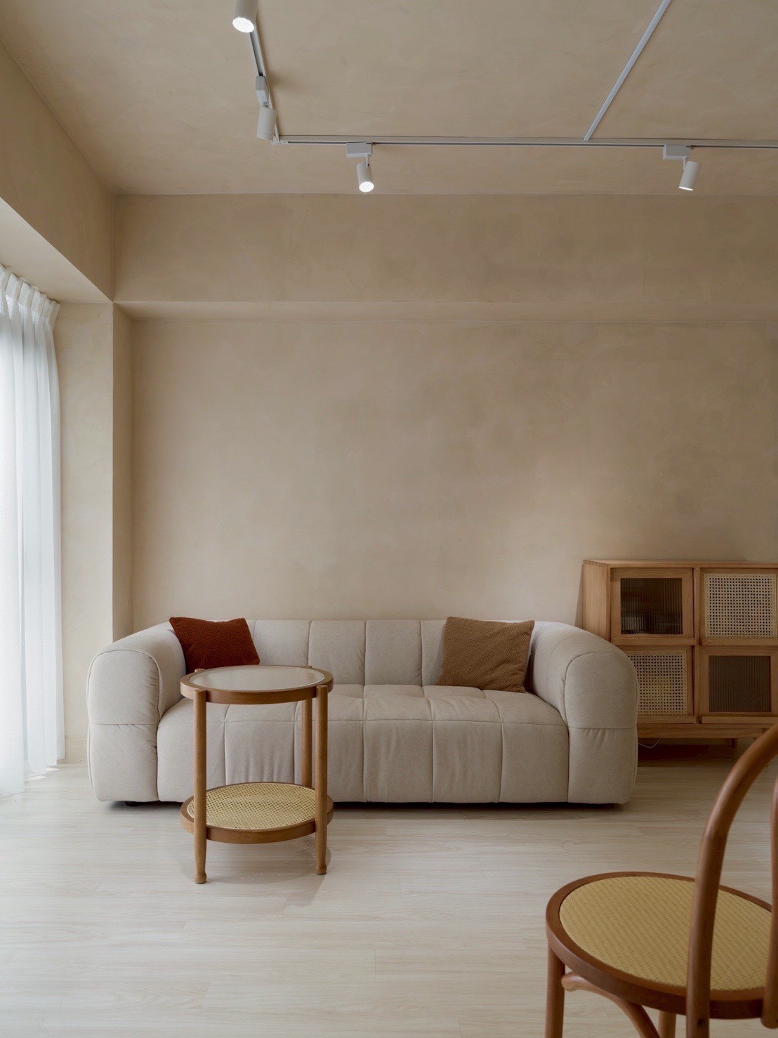 brown wooden bed frame with white and brown bed linen