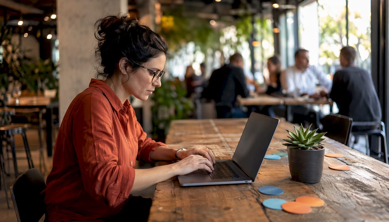 Tester typing on laptop using XML validation tools
