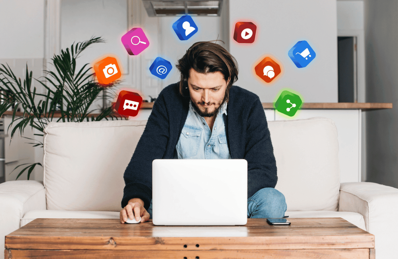 Man using laptop with floating icons - Hootsuite Alternative