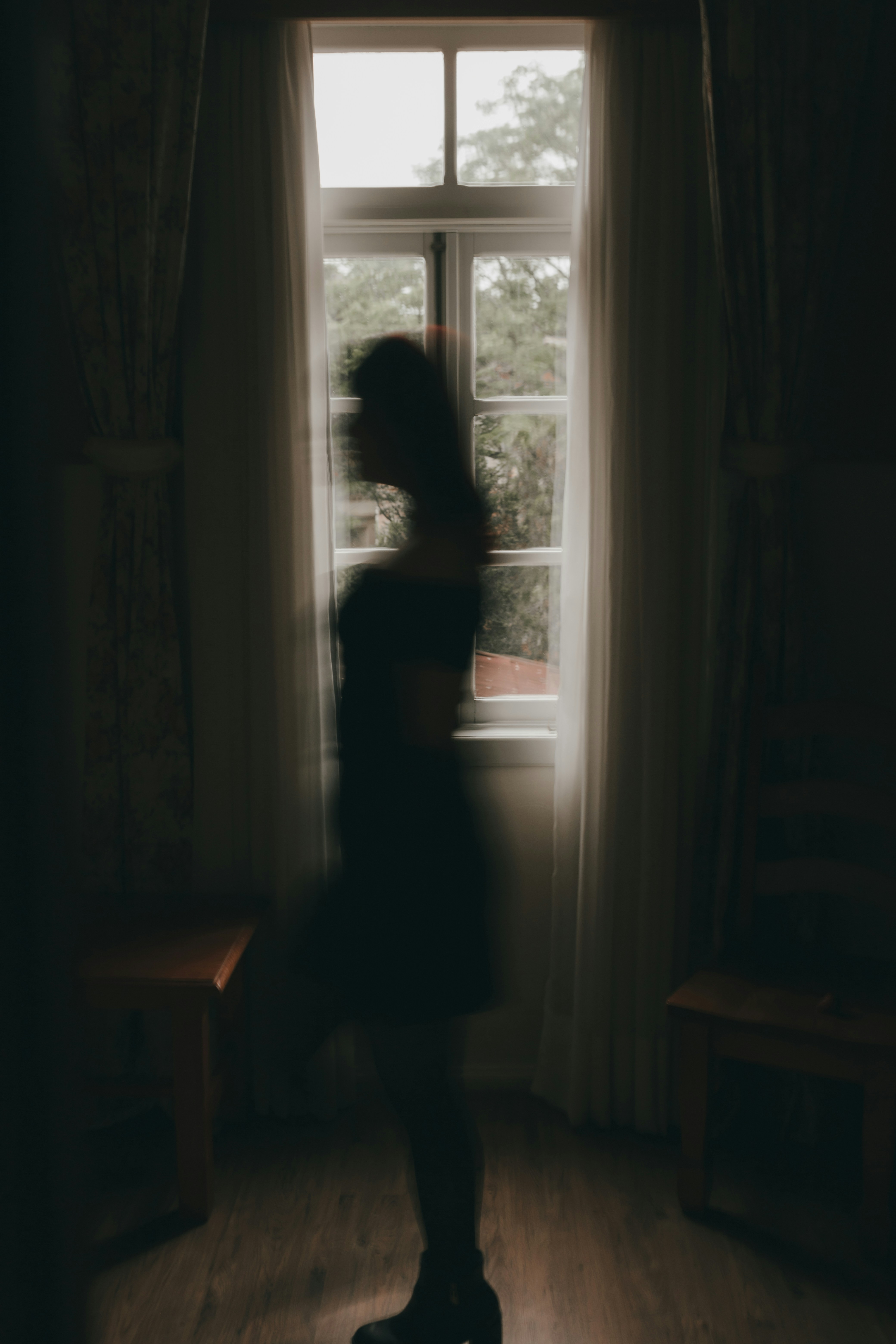 silhouette of a moving woman