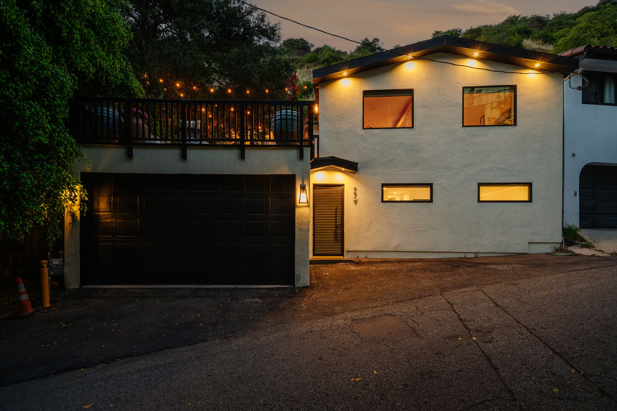 Elevated house with glass railings and scenic views