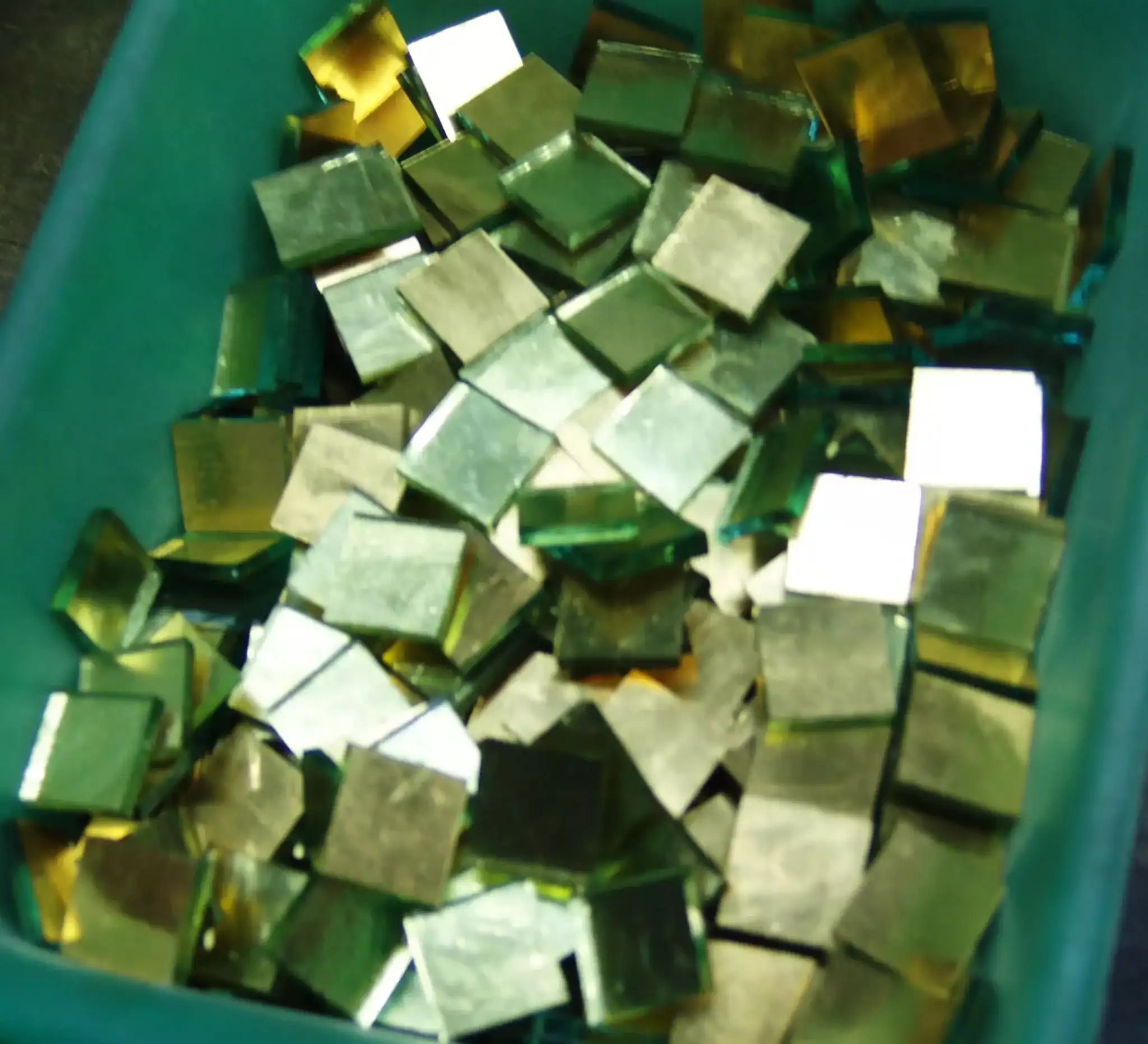 Vibrant mosaic glass tiles in various colors for artistic projects.