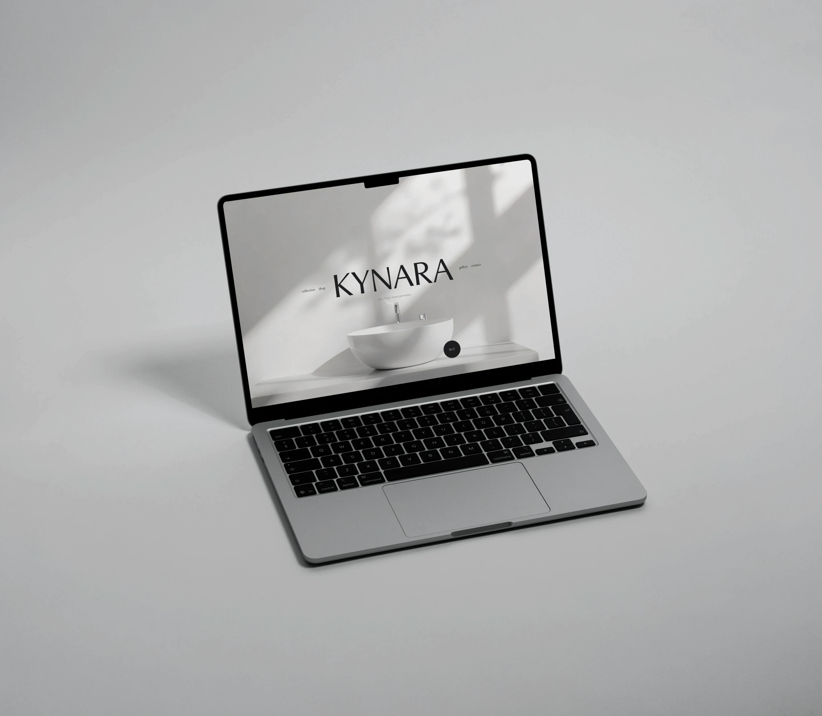 The website presented in a MacBook mockup.