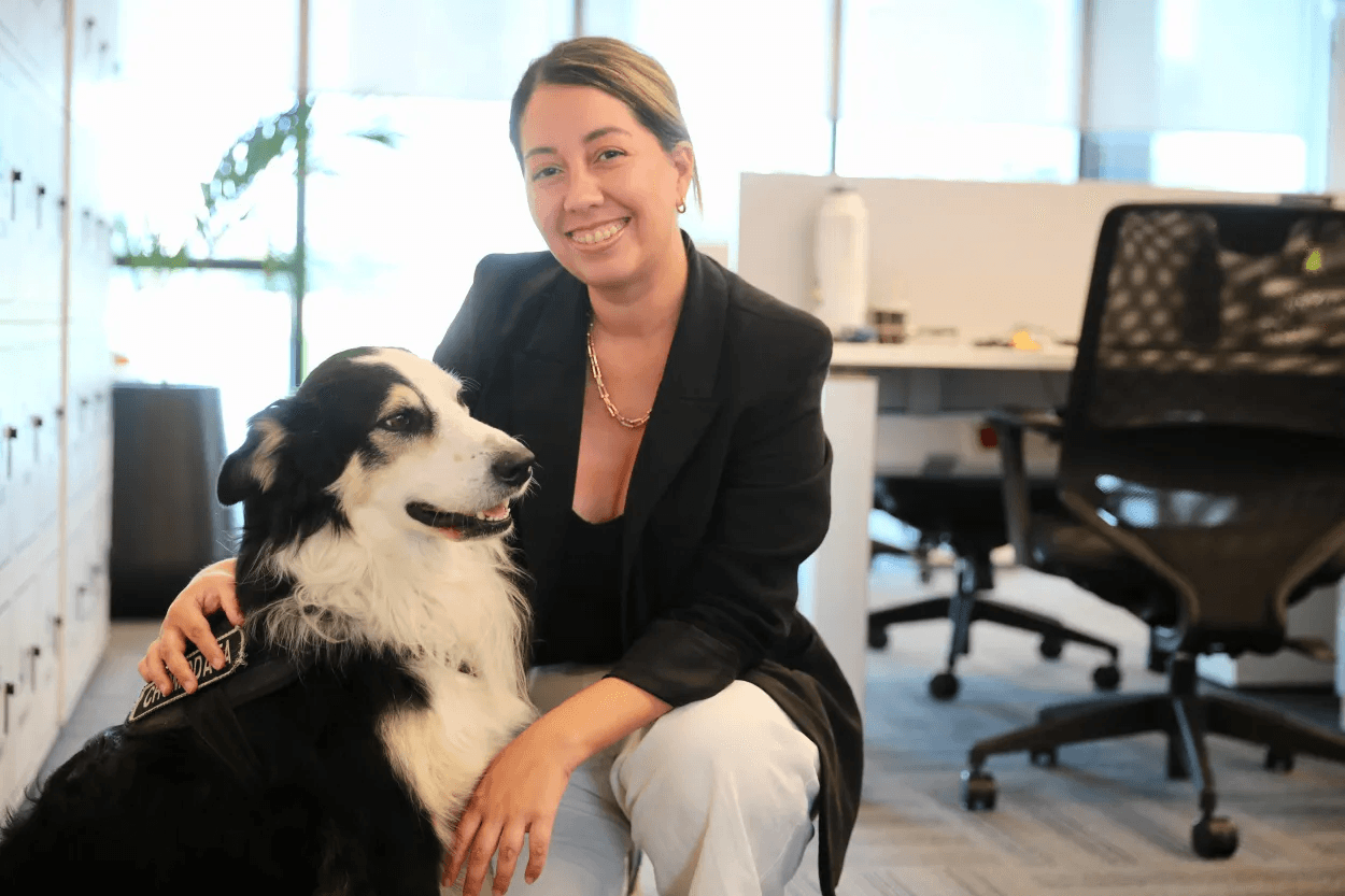 Keila Barral Masri alongside her dog.