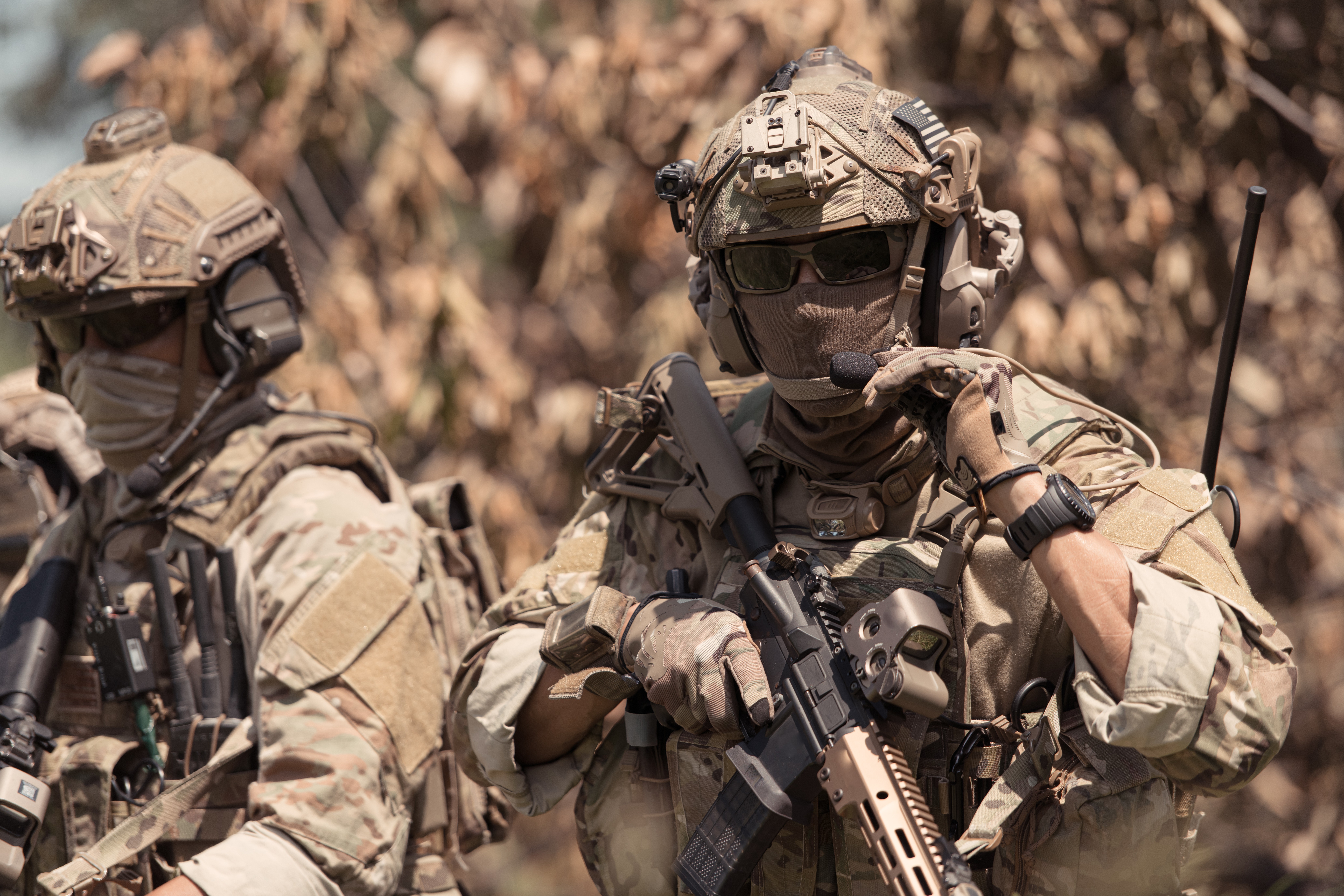 special ops soldier adjusting headcut microphone