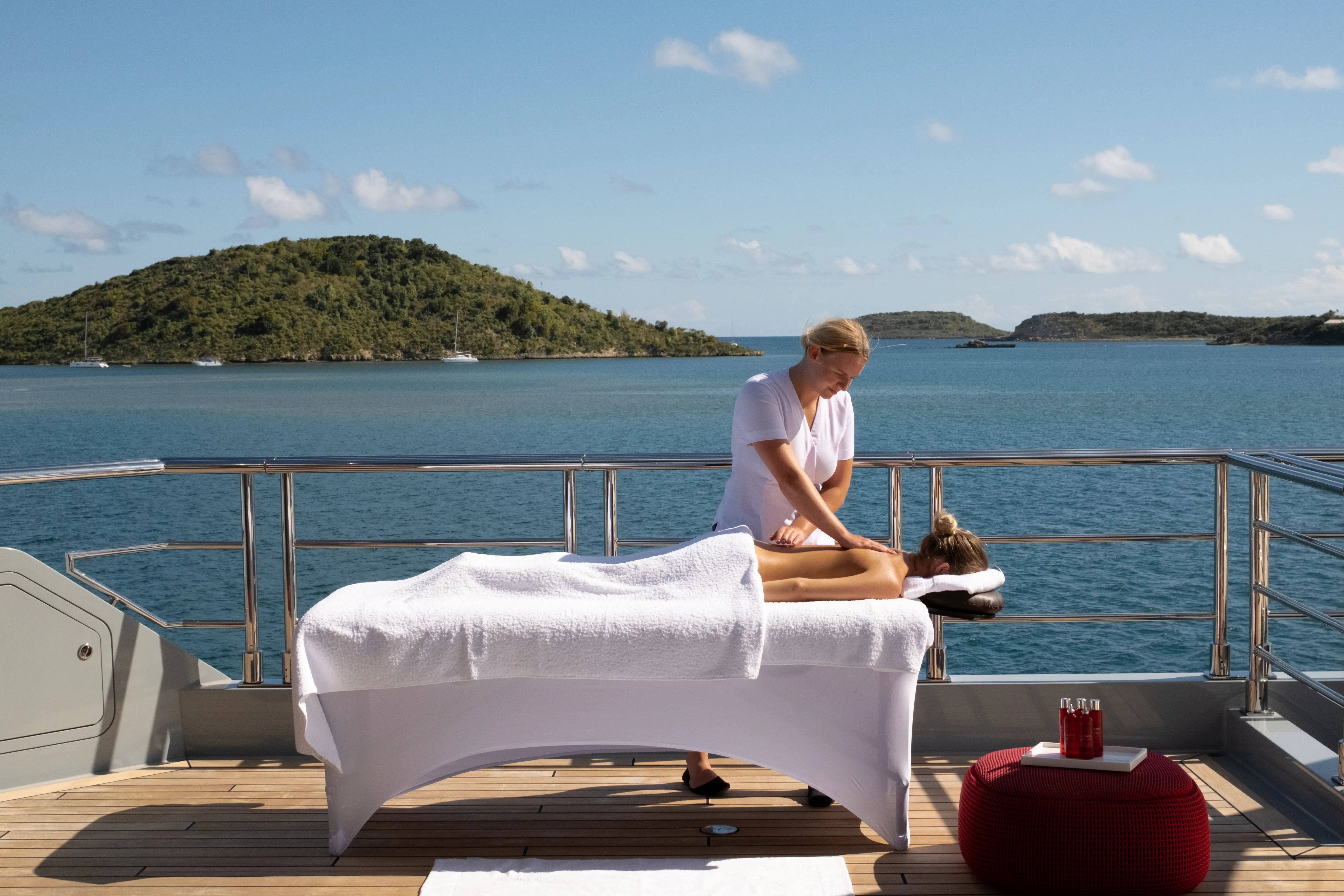 Sunlit wooden dining kitchen with plants and trees.