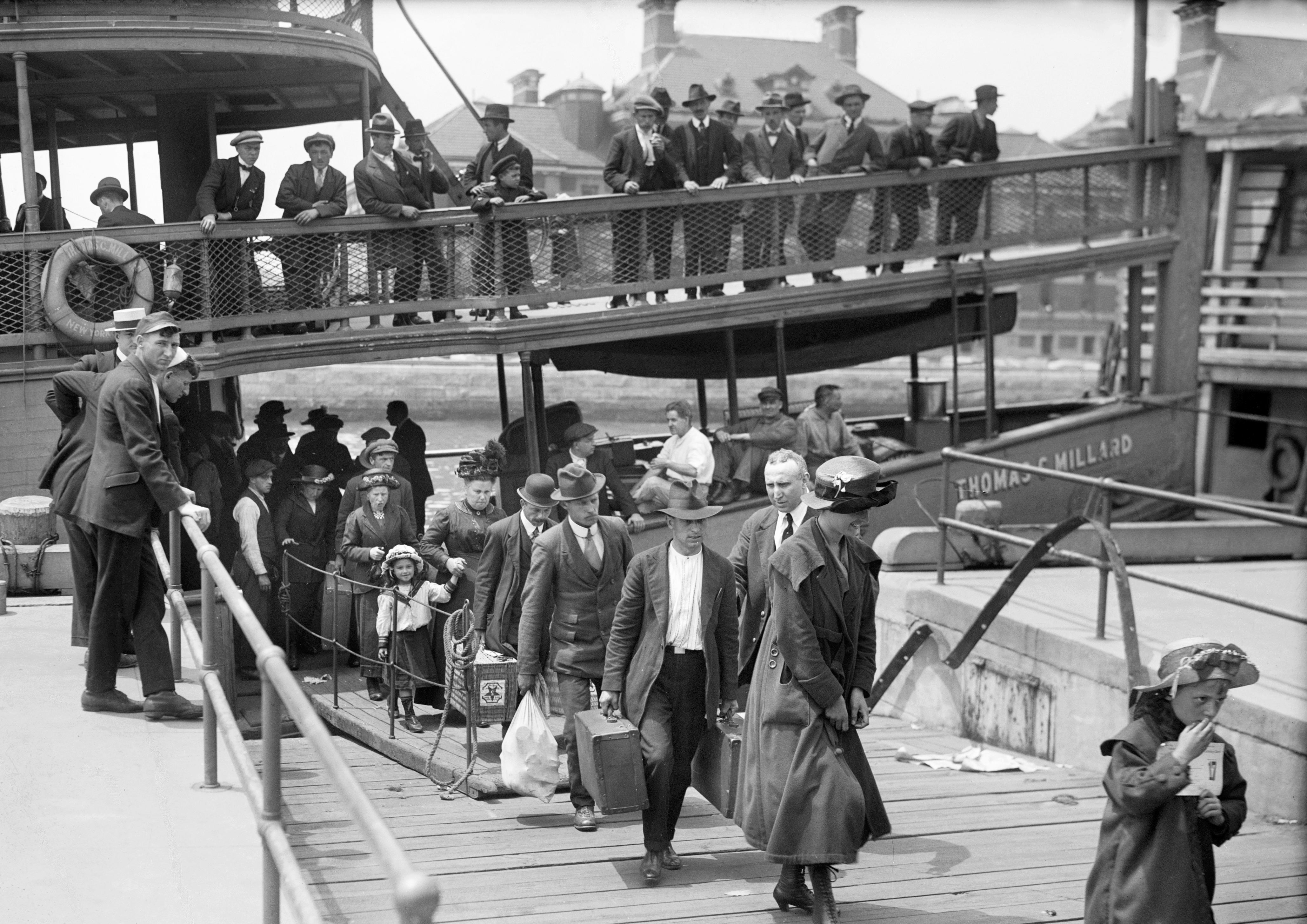 two women sitting beside table and talking