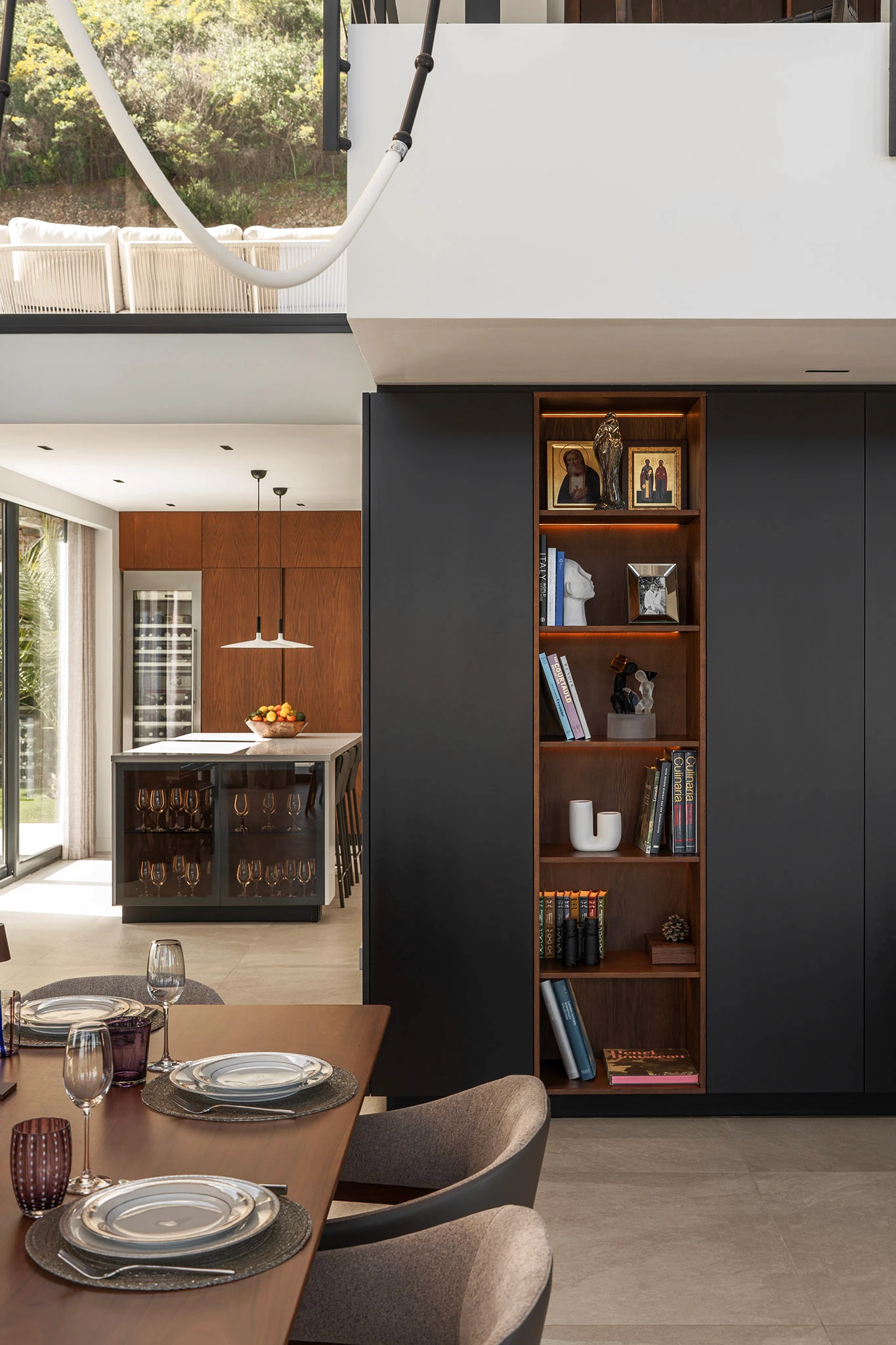 Villa Vista Marbella dining detail with built-in shelving and modern kitchen island