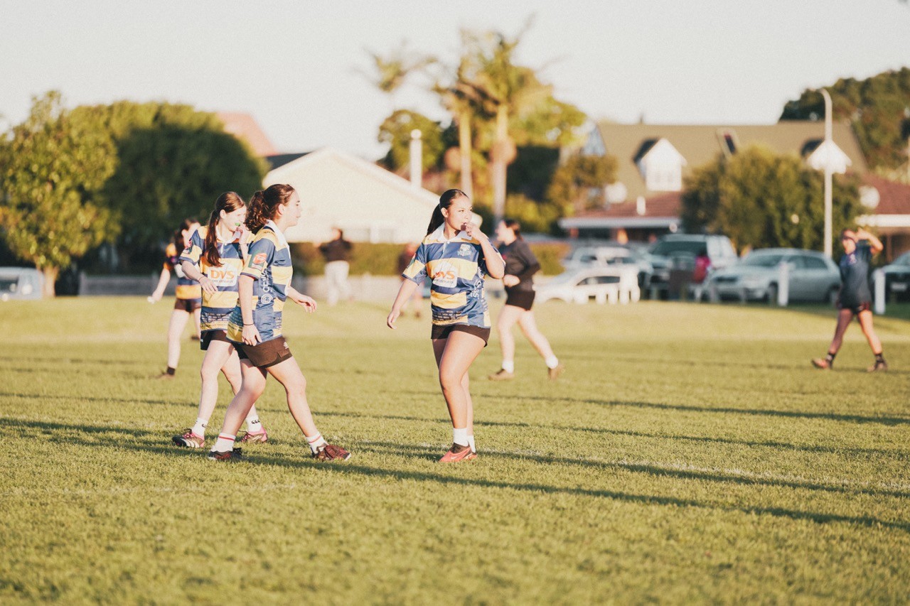 Rugby female player in the middle of a game