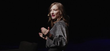 A speaker delivering a presentation at the conference.