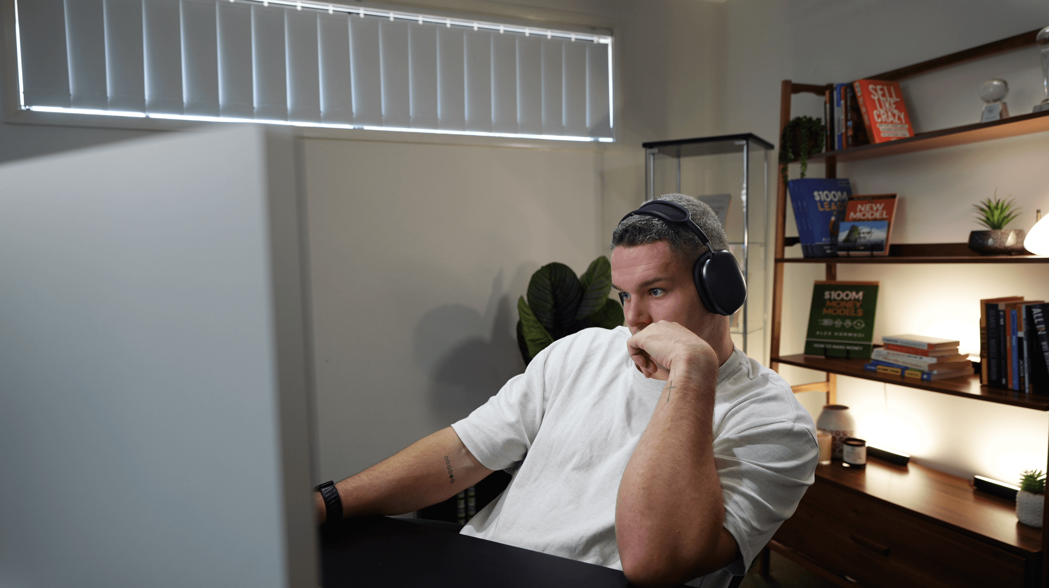 Blog article cover photo: Jacob Sutton working at his desk
