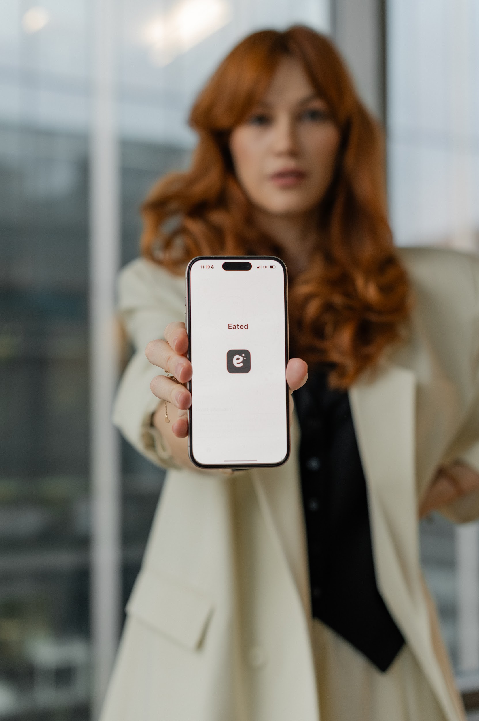 Irene Astaficheva showing the Eated app on her phone — habit-based eating coach