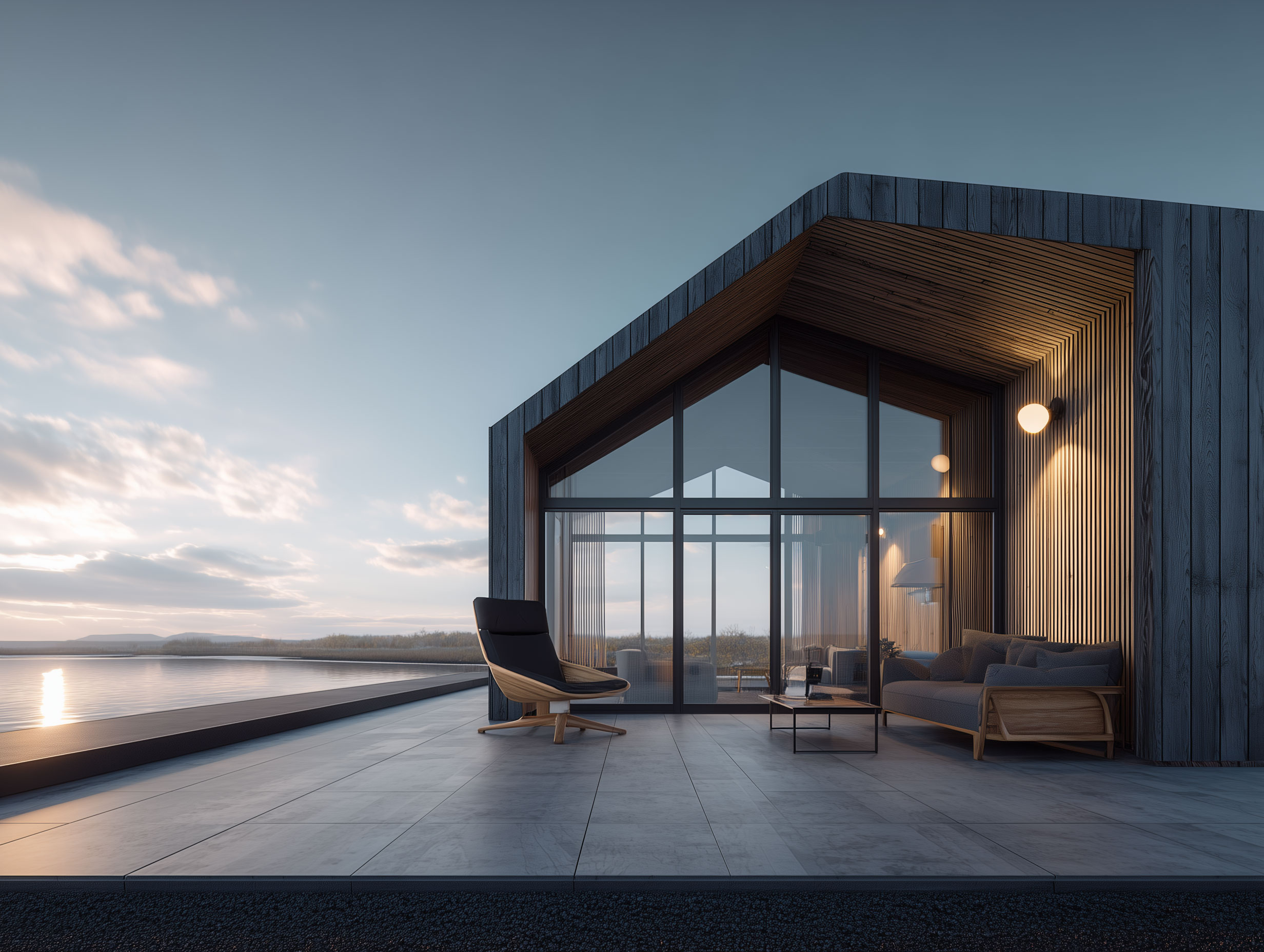 Interior view from living area toward the lake, large glass facade, minimal furniture.