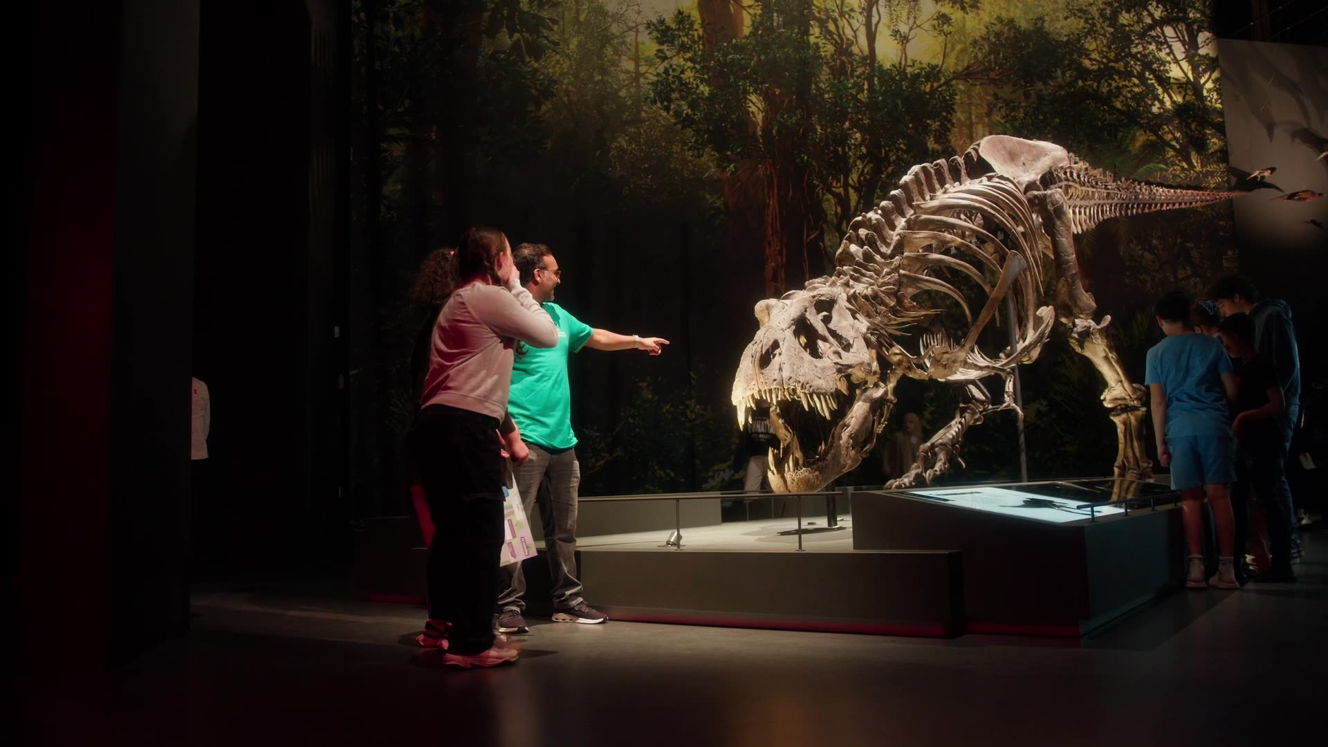 The image captures the ethereal beauty of an underwater cave illuminated by sunbeams penetrating through an opening above.