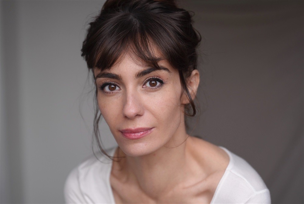 woman wearing brown top