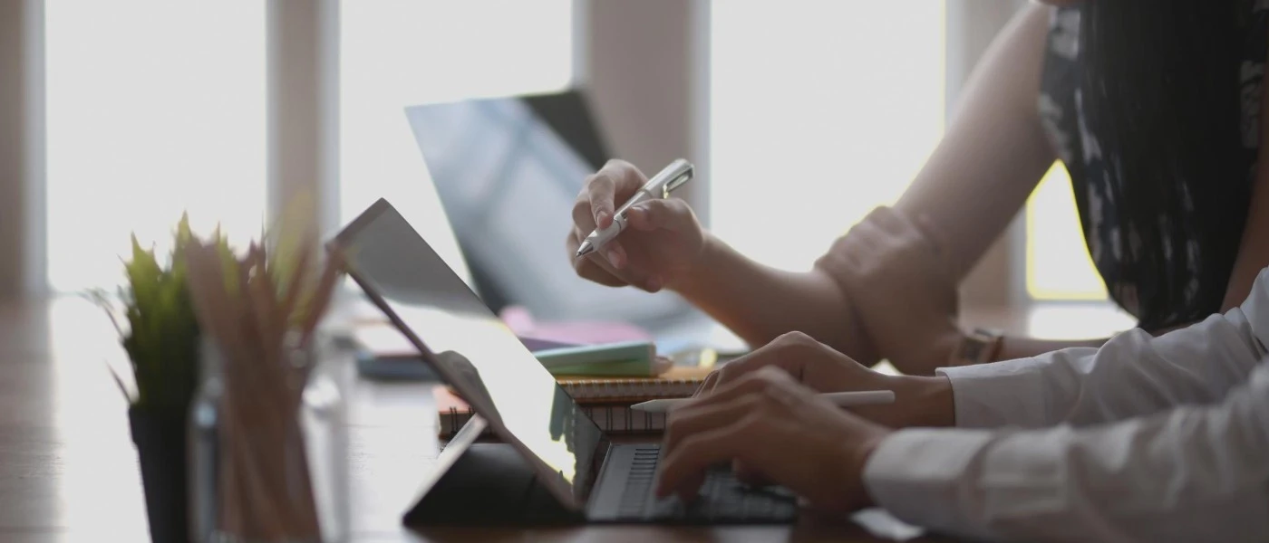 Close up photo of business man and woman working on table on office table