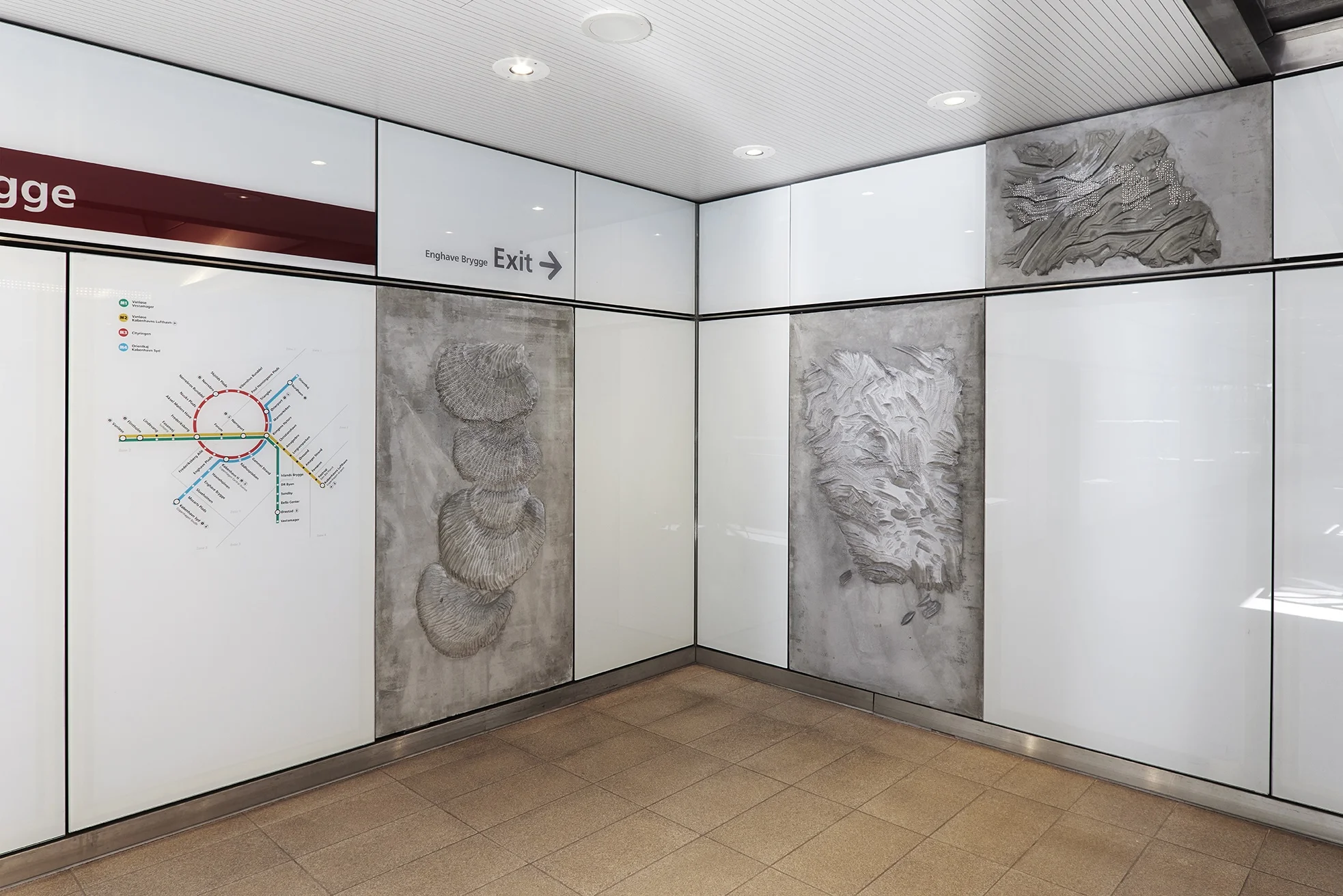 Installation photograph of the public commission work installed at Enghave Brygge Metro, Copenhagen. Concrete reliefs with optic fibers.