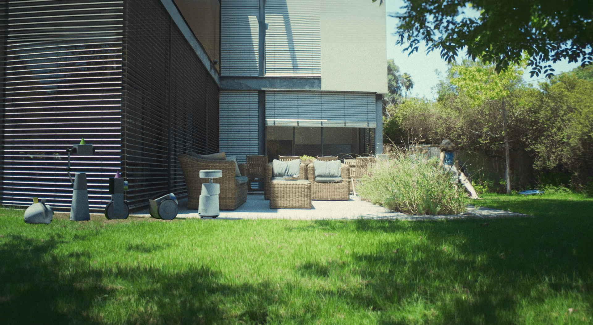 The robots follwing Eden through the yard