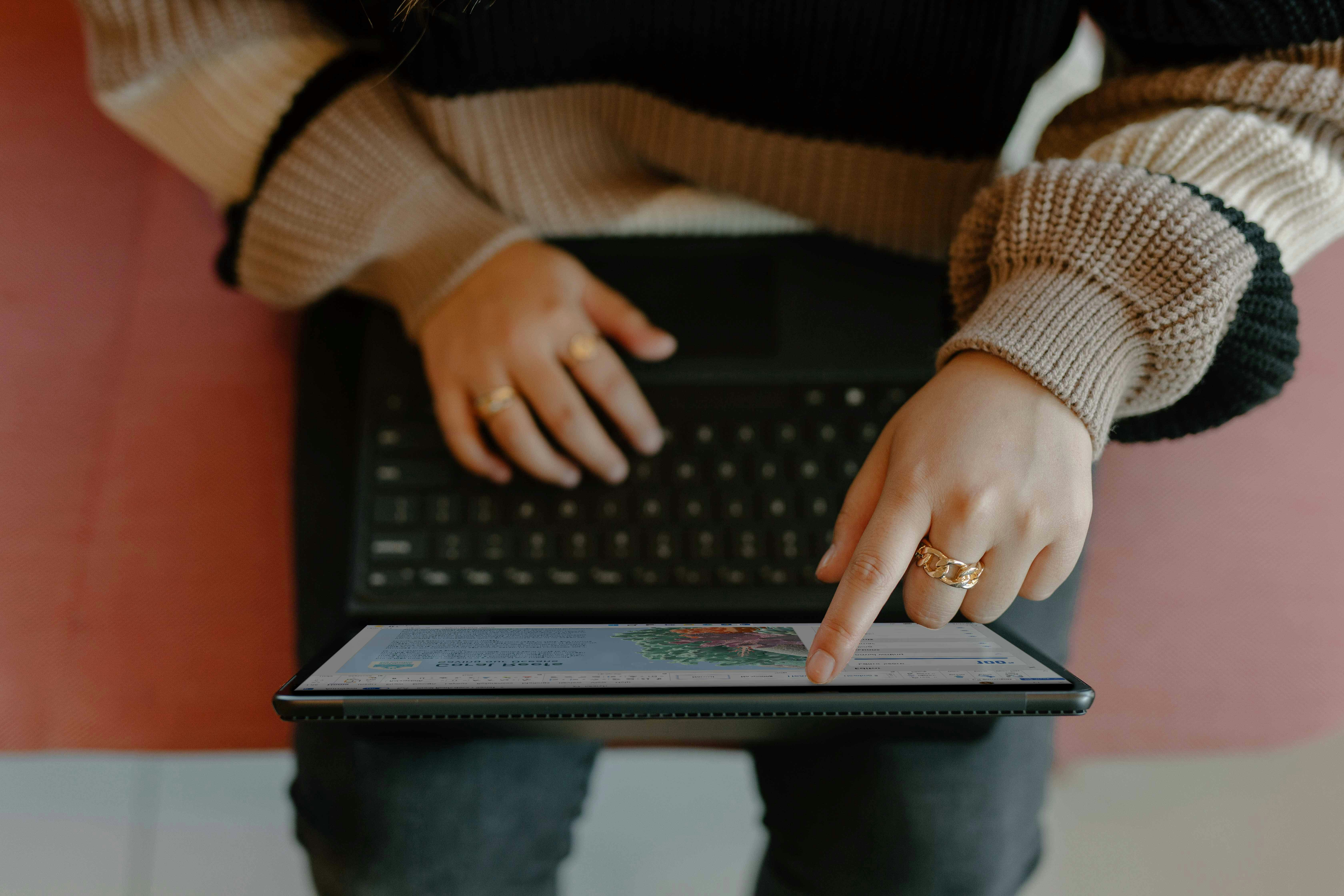 A user tapping their laptop device