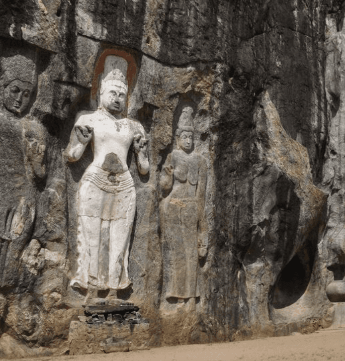 a group of women standing on top of a sandy beach
