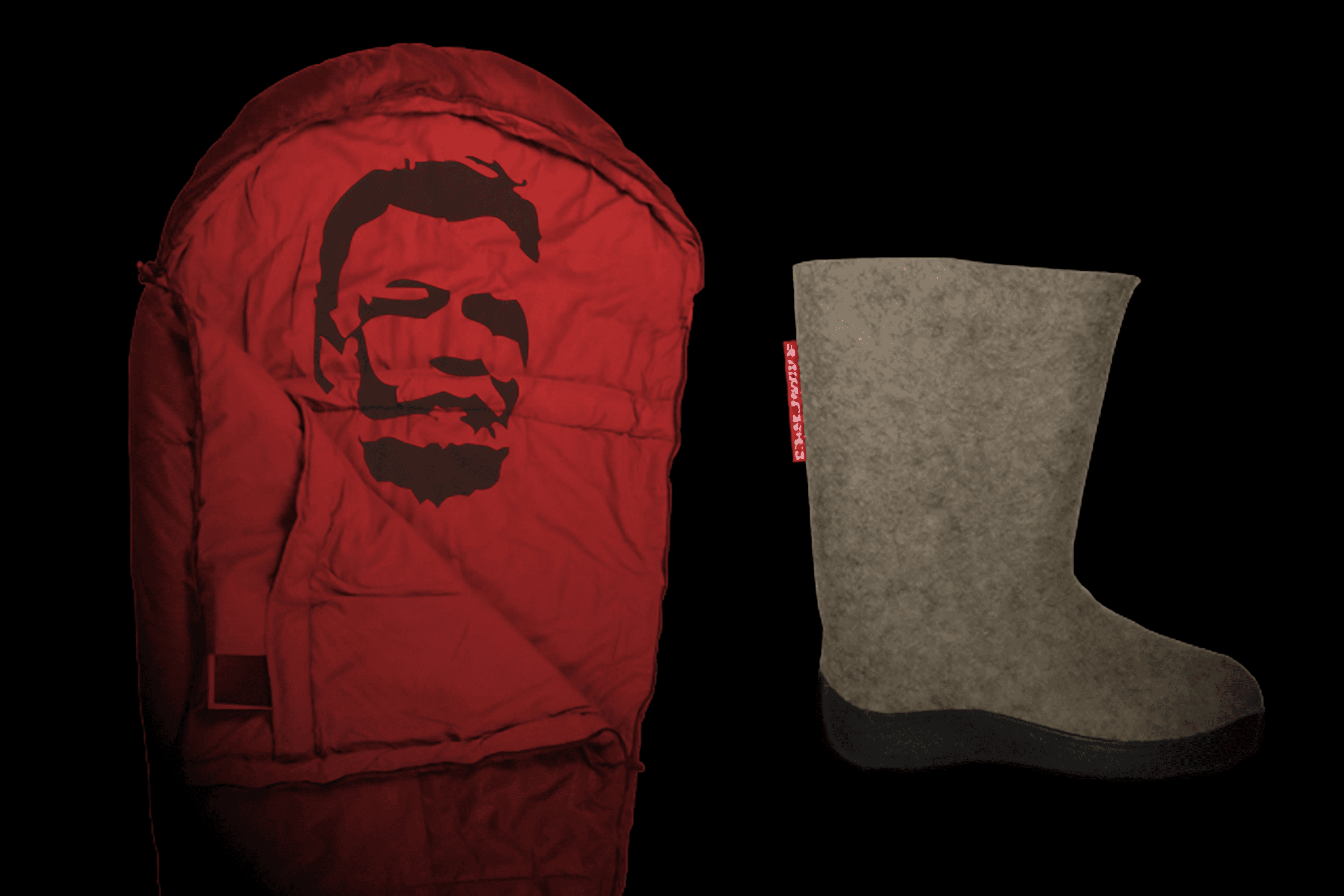 Red sleeping bag with face design and felt boot.