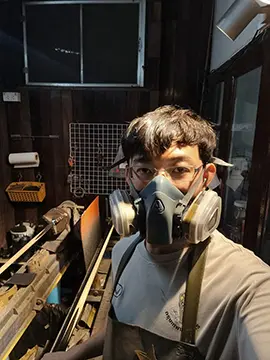 sunny akani taking a selfie while making cues