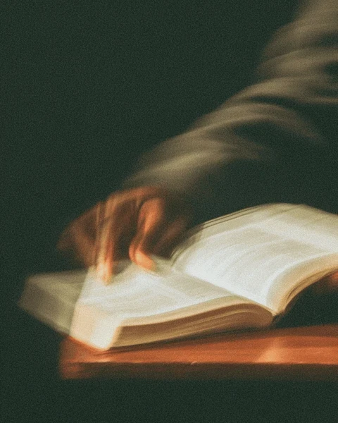 Someone turning the page of a book.
