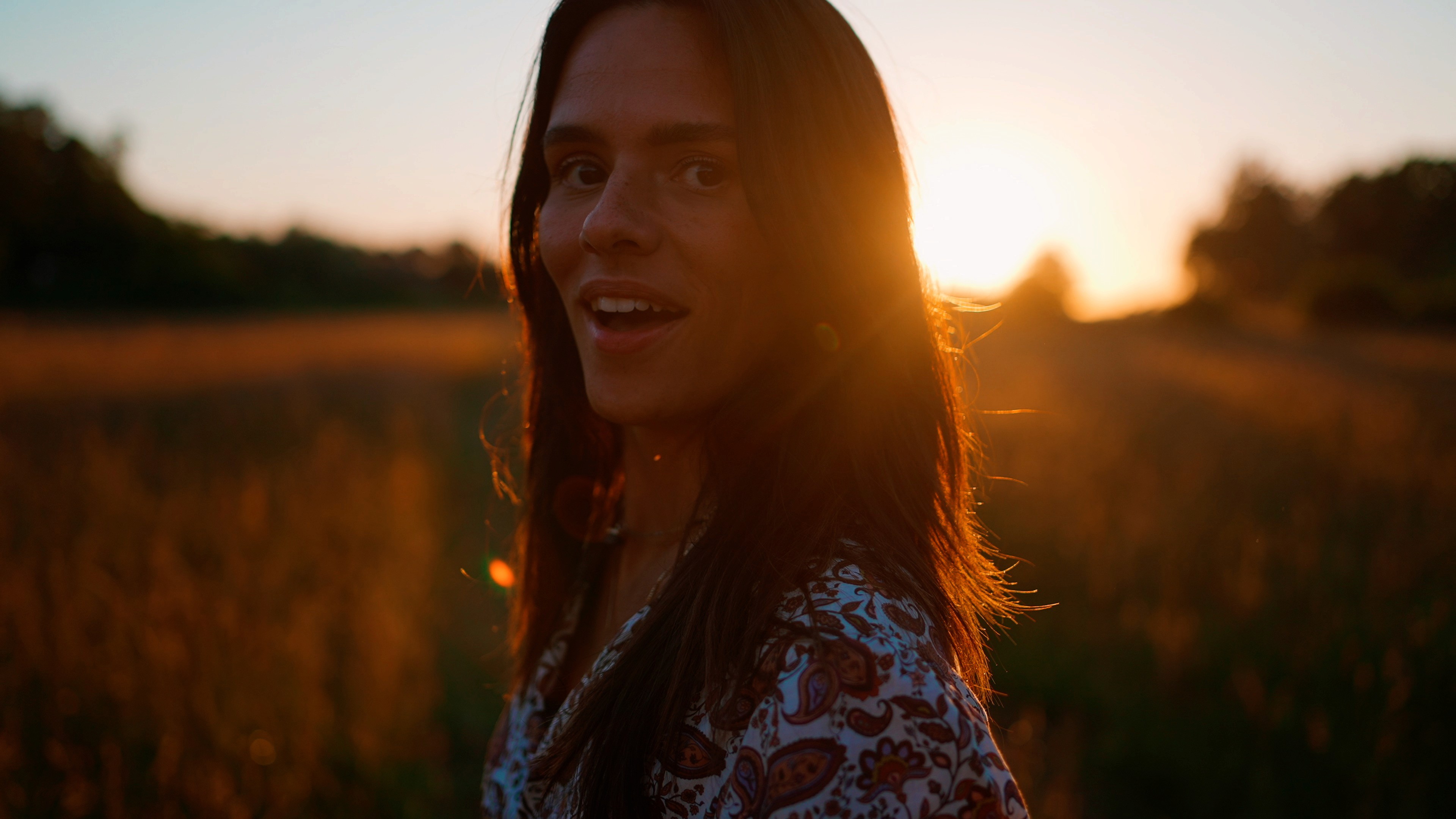 Lauren Jane in field at sunset