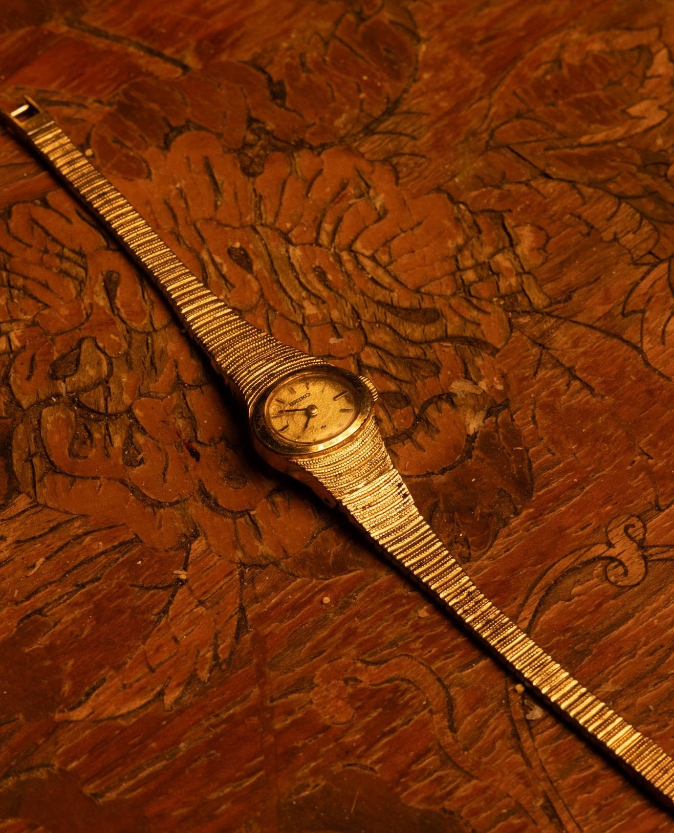 Vintage seiko rainbow watch displayed