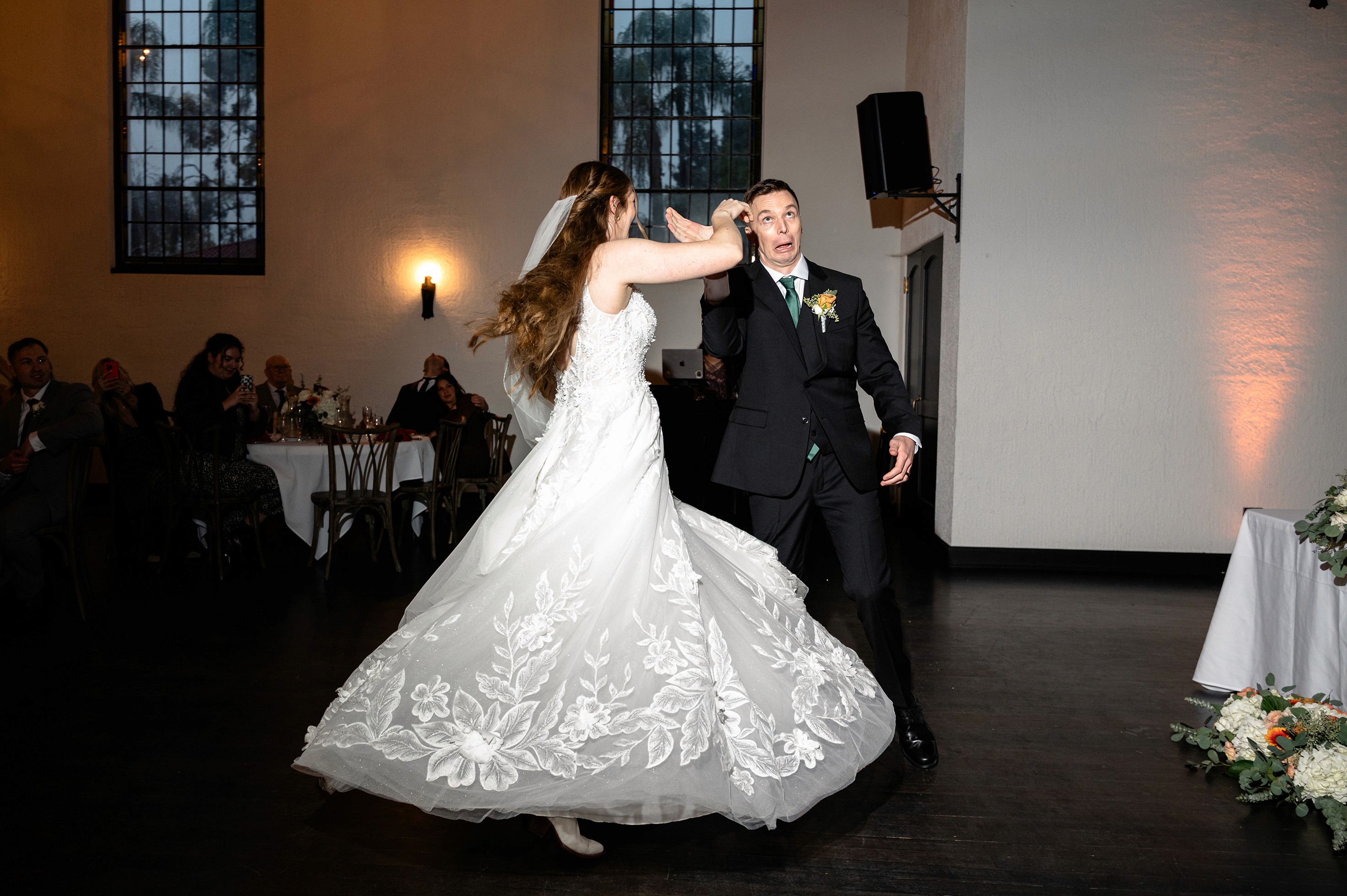 Flat lay wedding details with bouquet, rings, and sparkling bridal heels