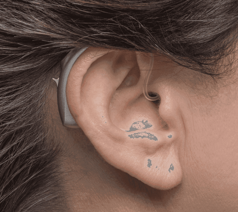 Doctor checking a male patient's hearing