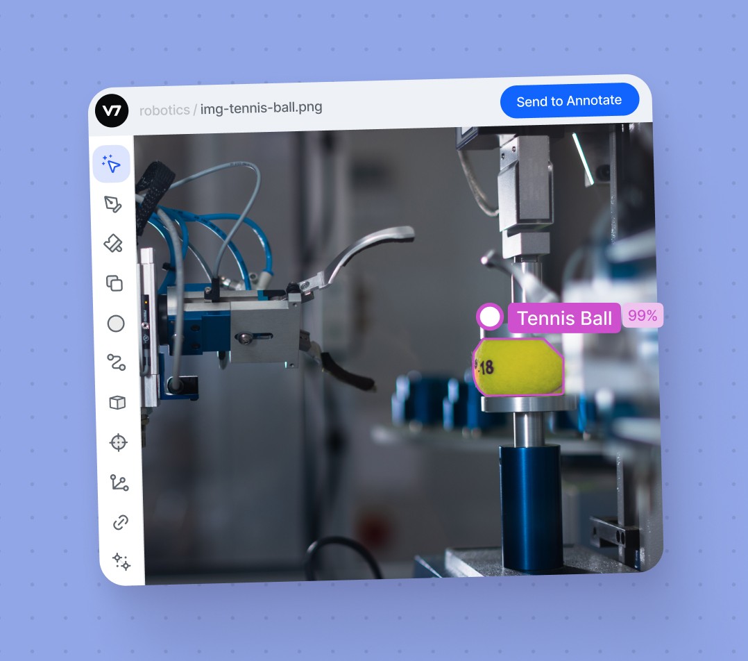 Image of an annotated tennis ball held by a robotic arm