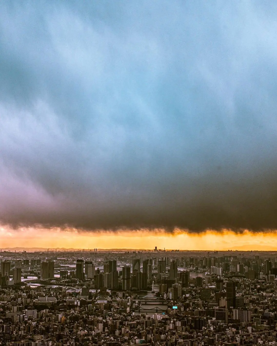Image of a asian young man in black tee Shirt on a sunset beach background