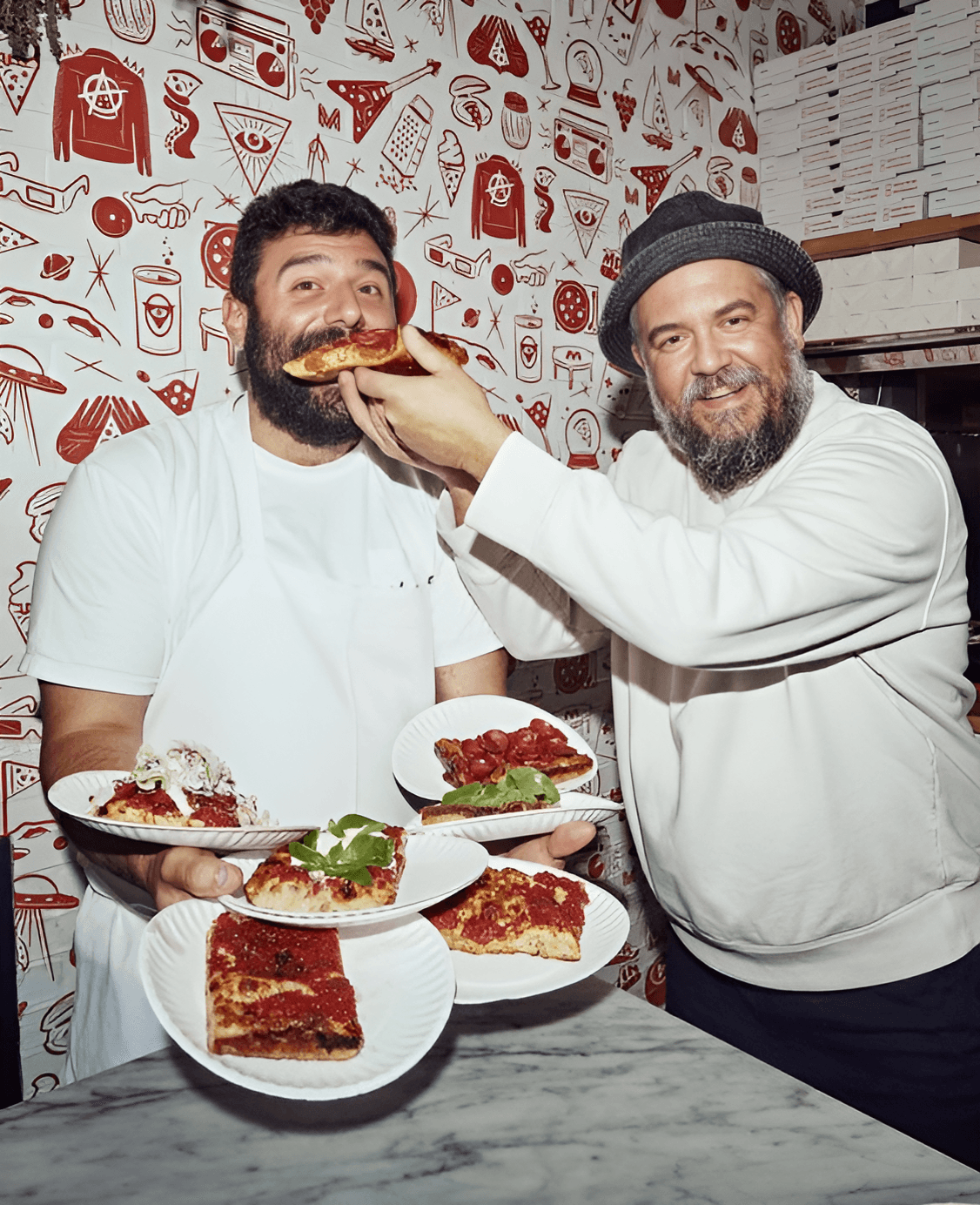 business owners eating pizza