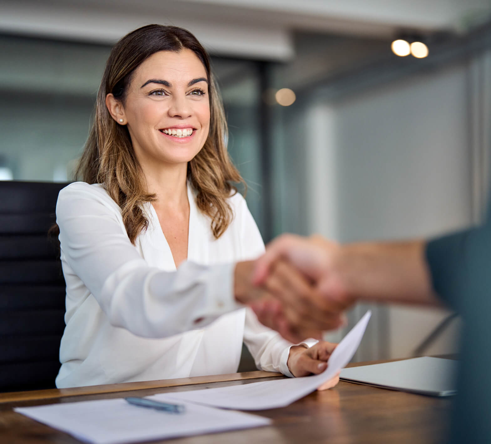 woman shaking hands with financial lender