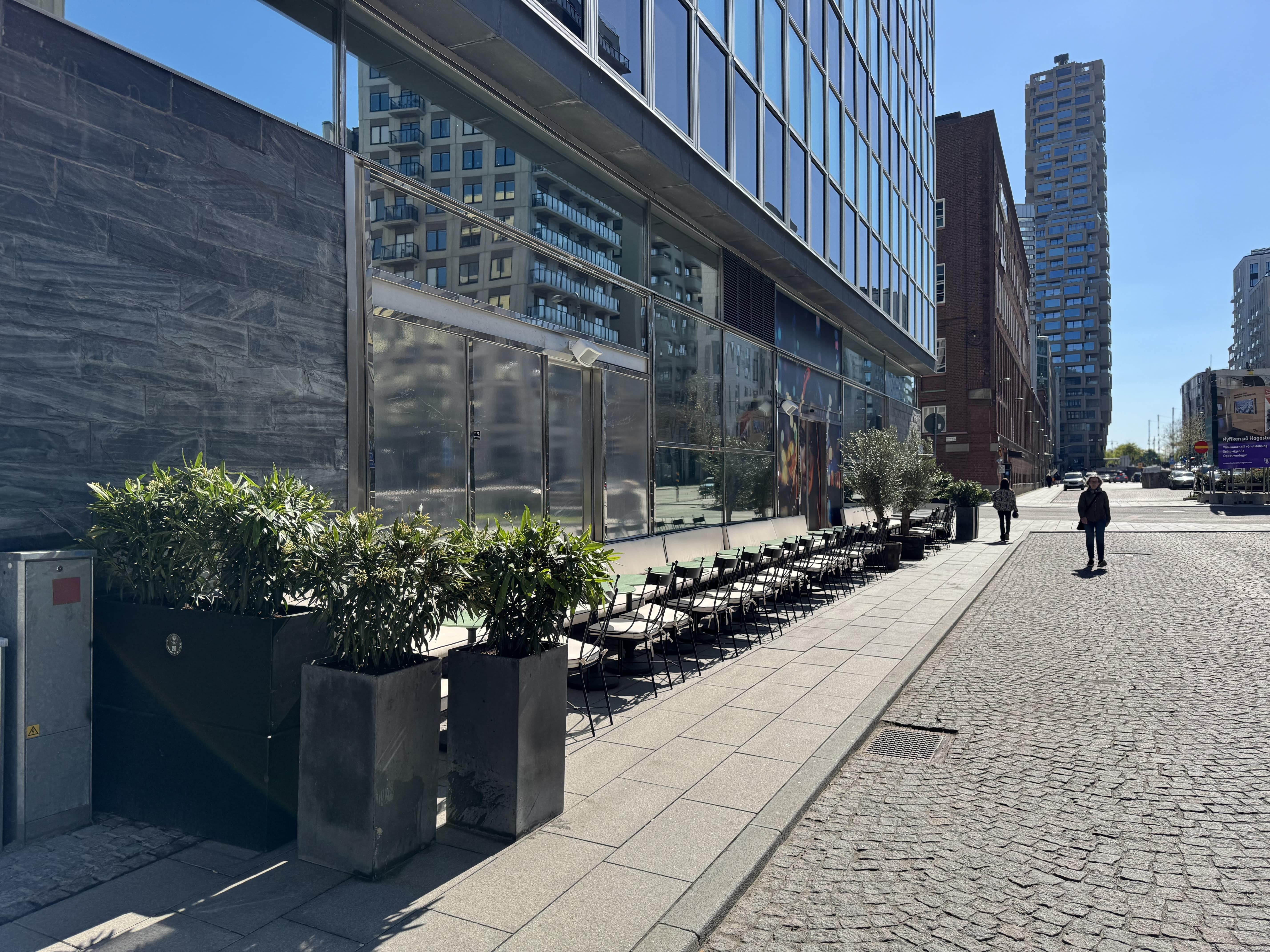 A chef placing fried chicken in a take away box