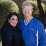 a man and a woman posing for photograph