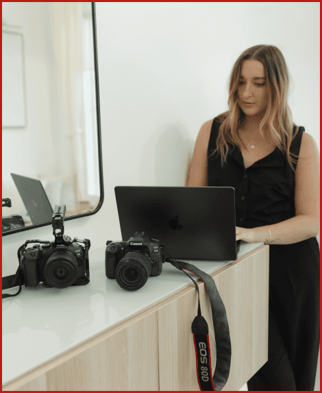 Photo of Emily Hoban, founder of Hoban ProMotions with laptop