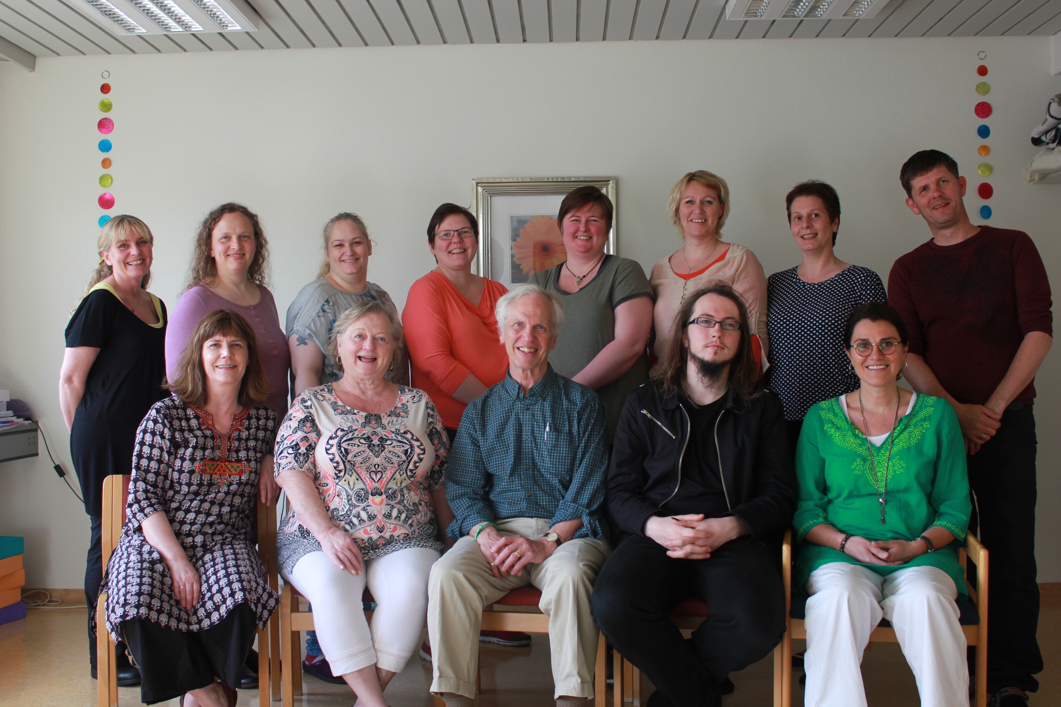 Scientist using a multi-channel pipette to transfer liquid samples in a lab, wearing gloves and surrounded by lab equipment.