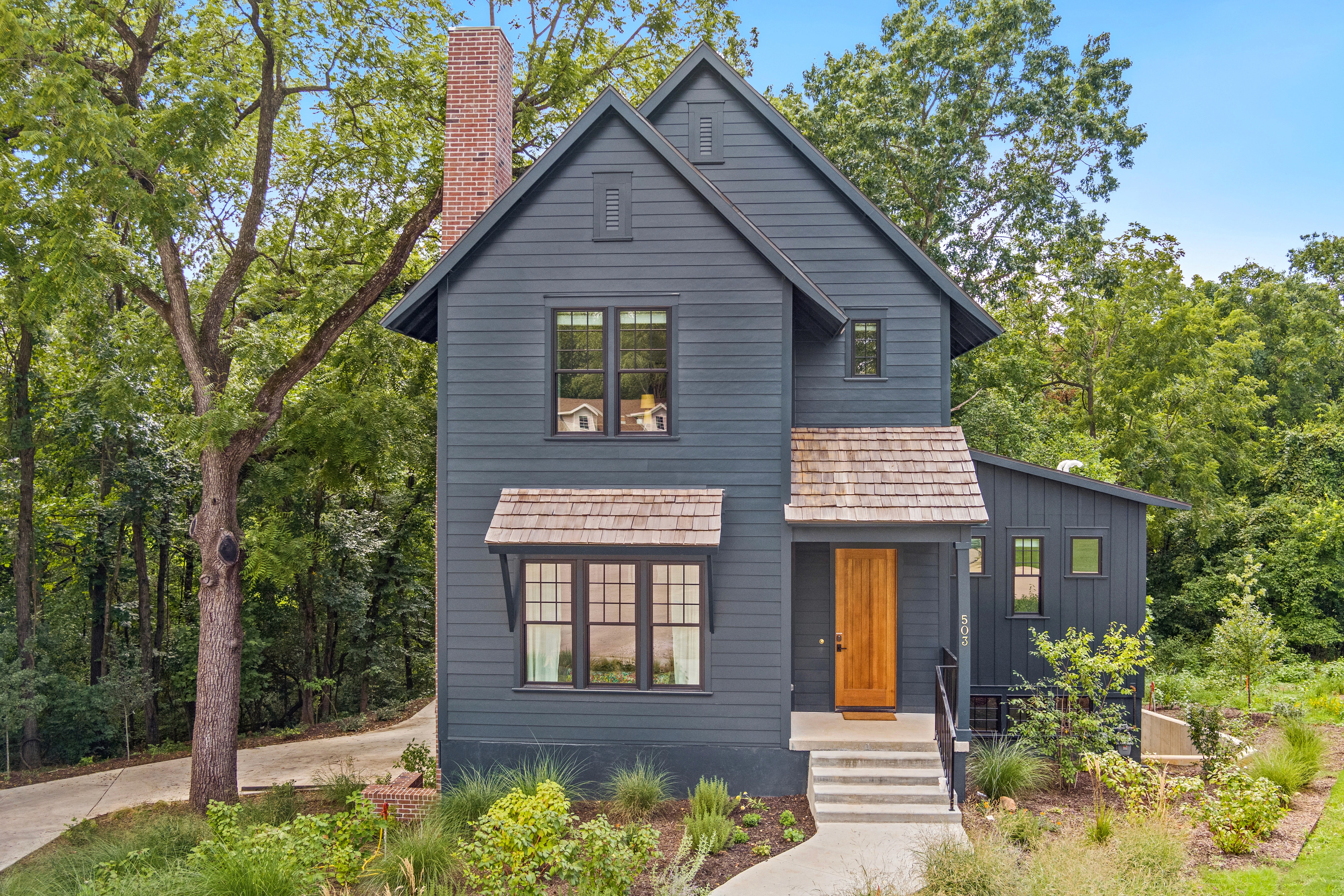Grey two story house on North Street desing by Alli